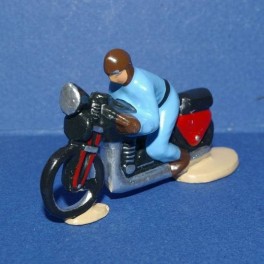 Motorbike blue following the cycling races